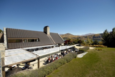 Amisfield Wine Company Lake Hayes Expansion, view of diners enjoying their meal alfresco on a sunny day.